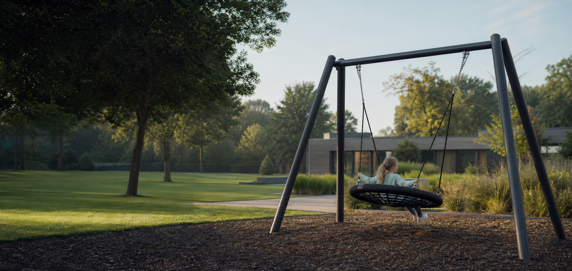 Nest swing installed in a landscaped outdoor project